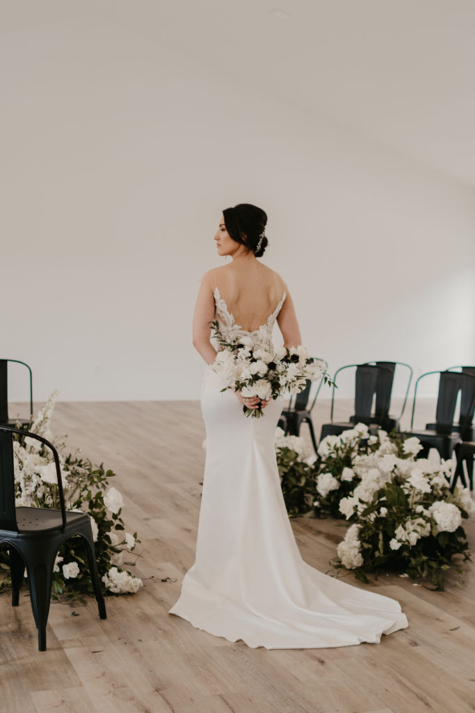 Formal bridal portrait with her flower bouquet.