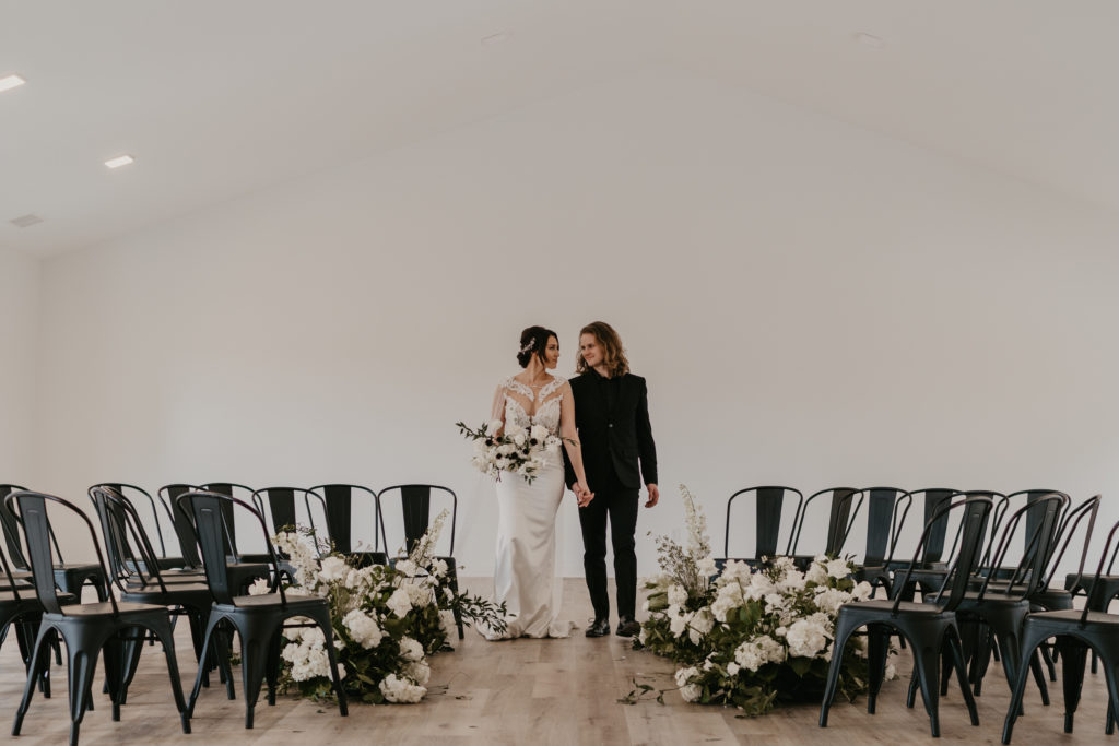Modern wedding couple at their alter.