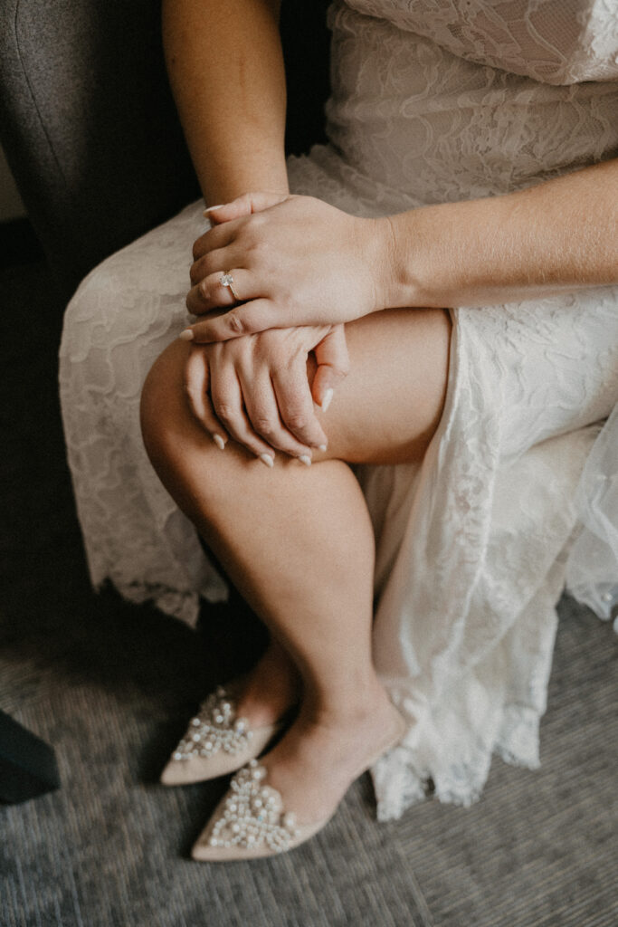Bridal details consisting of shoes and veil, photographed inside of The Oxbow Hotel.