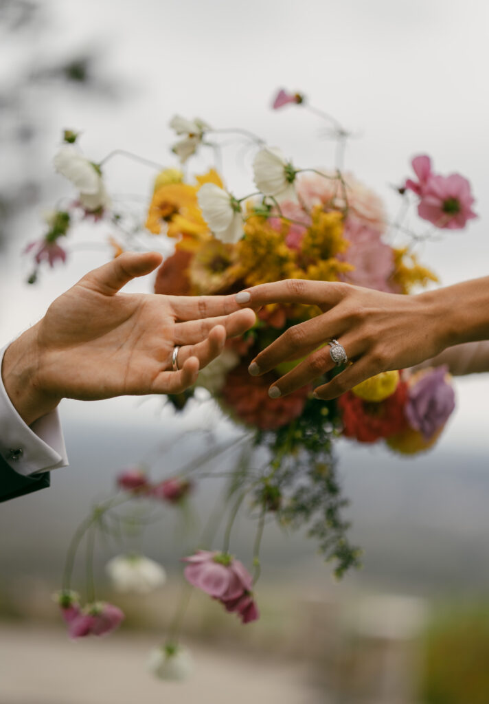 Wausau wedding photographer, creative portrait of bride and groom hands and rings.